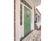 Elegant entryway with a green door and brick walkway at 43 Hasell St, Charleston, SC 29401