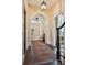 Elegant entryway with arched doorways, hardwood floors, and a patterned rug at 43 Hasell St, Charleston, SC 29401