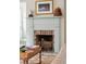 Brick fireplace with light-colored mantel in a living room at 43 Hasell St, Charleston, SC 29401