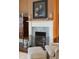 Elegant marble fireplace with brass fire screen and ornate mantel at 43 Hasell St, Charleston, SC 29401