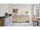Updated kitchen with light wood cabinets and stone countertops at 43 Hasell St, Charleston, SC 29401