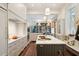 Spacious kitchen boasts marble countertops, custom cabinetry, and high-end appliances at 43 Hasell St, Charleston, SC 29401