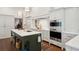 Spacious kitchen boasts marble countertops, custom cabinetry, and high-end appliances at 43 Hasell St, Charleston, SC 29401