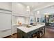 Spacious kitchen boasts marble countertops, custom cabinetry, and high-end appliances at 43 Hasell St, Charleston, SC 29401