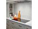 Modern kitchen features a marble countertop and a gas cooktop at 43 Hasell St, Charleston, SC 29401