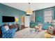 Bright living room with hardwood floors and large windows at 43 Hasell St, Charleston, SC 29401