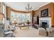 Spacious living room with bay windows, a fireplace, and comfortable seating at 43 Hasell St, Charleston, SC 29401