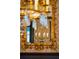 Ornate mirror reflecting a crystal chandelier at 43 Hasell St, Charleston, SC 29401