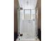 Modern glass-enclosed shower with patterned floor tiles at 43 Hasell St, Charleston, SC 29401