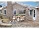 Brick patio with fire pit, seating, and access to the home at 4334 Bream Rd, North Charleston, SC 29418
