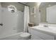 Clean bathroom with white vanity, tub and shower, and octagon window at 4334 Bream Rd, North Charleston, SC 29418