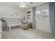 Bedroom with crib, armchair, and plenty of storage at 4334 Bream Rd, North Charleston, SC 29418