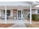 Charming front entrance with white columns, a wreath, and brick accents at 4334 Bream Rd, North Charleston, SC 29418