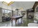 Game room featuring a pool table, TV, and brick walls at 4334 Bream Rd, North Charleston, SC 29418