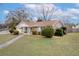 Brick ranch house with landscaped yard and walkway at 4334 Bream Rd, North Charleston, SC 29418