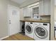Bright laundry room with washer, dryer, and ample counter space at 4334 Bream Rd, North Charleston, SC 29418