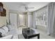 Relaxing living area with built-in shelving, sofa, and large window with curtains at 4334 Bream Rd, North Charleston, SC 29418