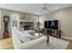 Living room with a fireplace, sectional sofa, and hardwood floors at 4334 Bream Rd, North Charleston, SC 29418