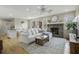 Spacious living room with a fireplace, sectional sofa, and hardwood floors at 4334 Bream Rd, North Charleston, SC 29418