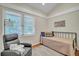 Small bedroom with daybed and comfortable armchair at 477 Sea Cloud Cir, Edisto Island, SC 29438