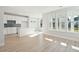 Modern kitchen with white cabinets, island, and blue backsplash at 482 Queenview Ln, Charleston, SC 29414