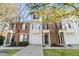 Brick front exterior of charming townhome with attached garage and landscaping at 5009 Double Fox Rd # H5, Charleston, SC 29414