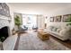 Spacious living room with fireplace and large windows at 5200 Princeton St, North Charleston, SC 29405