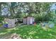 Large backyard with shed, playset, and raised garden beds at 5242 Potomac St, North Charleston, SC 29405