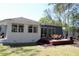 Backyard view featuring a spacious deck with outdoor seating and a well-maintained lawn at 5242 Potomac St, North Charleston, SC 29405