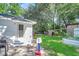 Spacious backyard with patio, shed, playset, and raised garden beds at 5242 Potomac St, North Charleston, SC 29405
