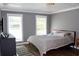 Bedroom with wood floors, two windows, and gray walls at 5242 Potomac St, North Charleston, SC 29405
