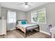 Bright bedroom with a metal bed frame and window with blinds at 5242 Potomac St, North Charleston, SC 29405