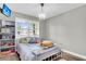 bedroom with white metal bed and colorful accents at 5242 Potomac St, North Charleston, SC 29405