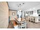 Open concept dining area with farmhouse table and kitchen views at 5242 Potomac St, North Charleston, SC 29405