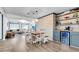 Farmhouse-style dining area with wooden table and built-in bar at 5242 Potomac St, North Charleston, SC 29405