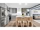 Gray kitchen with marble island, stainless steel appliances, and white subway tile backsplash at 5242 Potomac St, North Charleston, SC 29405