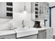 Modern farmhouse kitchen with white farm sink and gray cabinets at 5242 Potomac St, North Charleston, SC 29405