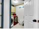 Bright laundry room with washer, dryer, and storage cabinets at 5242 Potomac St, North Charleston, SC 29405