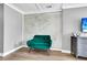 Relaxing sitting area with emerald green velvet chair at 5242 Potomac St, North Charleston, SC 29405