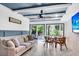 Sunroom features a ceiling fan, tiled flooring, and access to the backyard at 5242 Potomac St, North Charleston, SC 29405