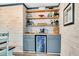 Built-in wet bar with beverage fridge and shelving at 5242 Potomac St, North Charleston, SC 29405