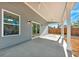 Covered patio with ceiling fan and access from the house at 5889 N Rhett Ave, Hanahan, SC 29410
