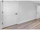 Simple bedroom with neutral walls and wood-look floors at 5889 N Rhett Ave, Hanahan, SC 29410