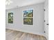 Charming bedroom with wood-look floors and large windows at 5889 N Rhett Ave, Hanahan, SC 29410