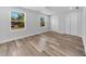 Spacious bedroom with wood-look flooring, ceiling fan, and ample closet space at 5889 N Rhett Ave, Hanahan, SC 29410