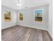 Bright bedroom with ceiling fan and wood-look floors at 5889 N Rhett Ave, Hanahan, SC 29410