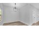 Dining area with shiplap accent wall and modern light fixture at 5889 N Rhett Ave, Hanahan, SC 29410