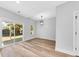 Bright dining area with wood-look floors and shiplap accent wall at 5889 N Rhett Ave, Hanahan, SC 29410