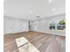 Sunlit living room featuring hardwood floors and an open floor plan at 5889 N Rhett Ave, Hanahan, SC 29410
