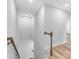 Modern staircase with light gray walls and wood flooring at 5889 N Rhett Ave, Hanahan, SC 29410